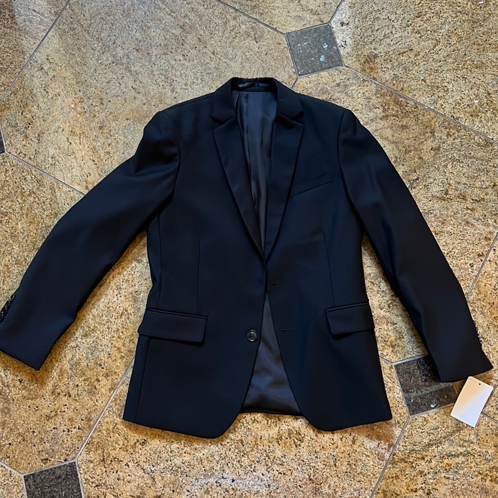 Brand new with tags. Black Isaac Mizrahi and boys size 12 blazer.